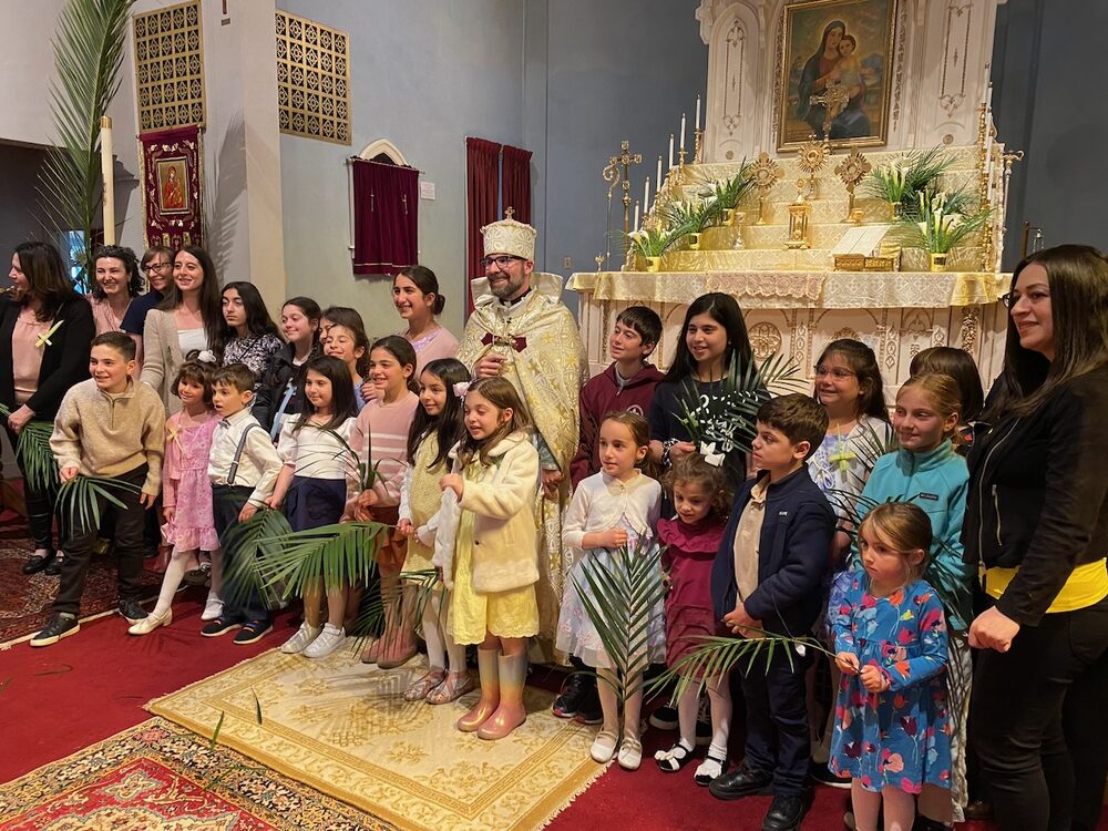 Children and adults gathered in the sanctuary.