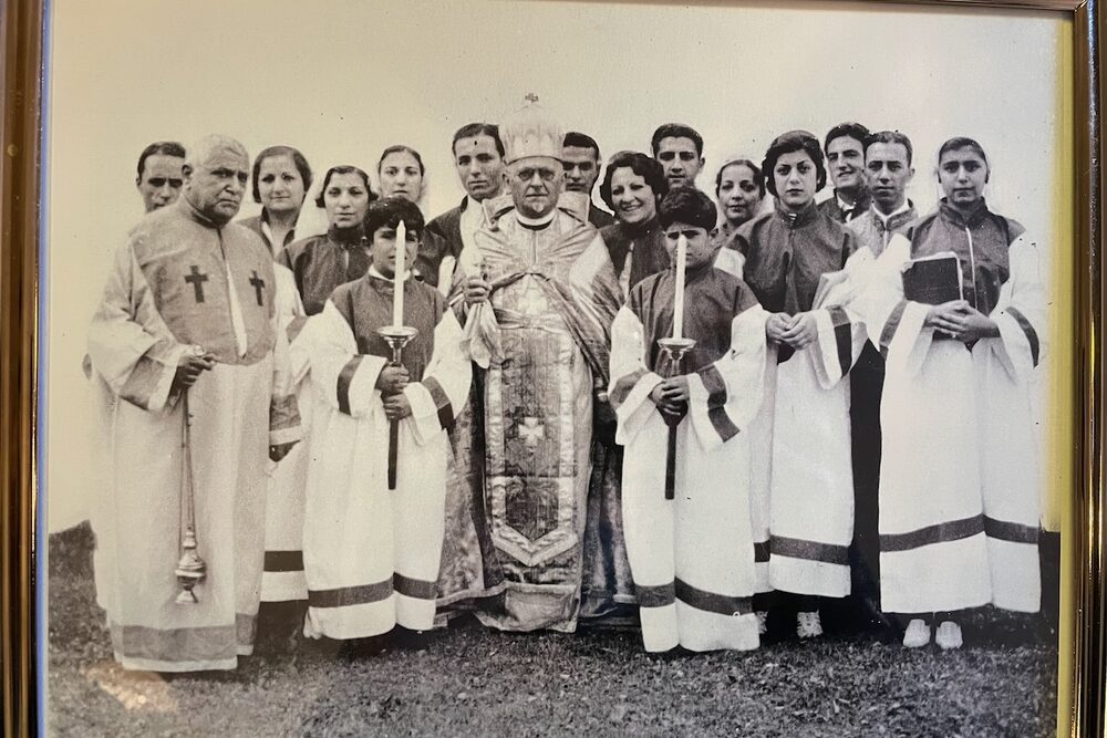 Historic choir members and clergy wearing liturgical robes.