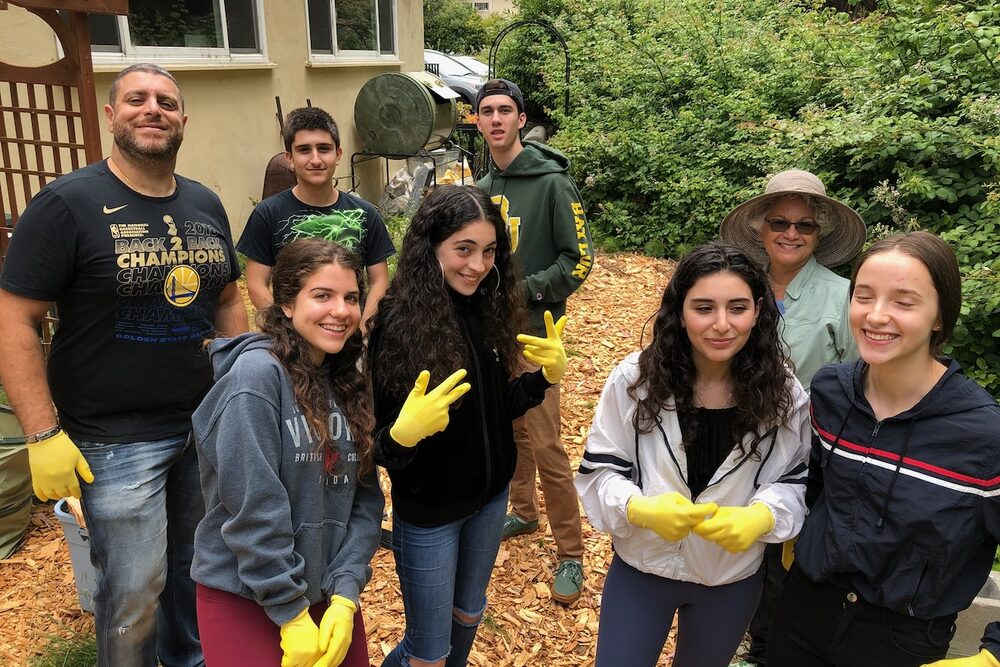 Volunteers working together in the church garden.