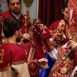 Archbishop Hovnan Derderian blesses Daniel Koloyian during the ordination service