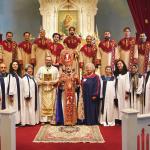 Group photo with Archbishop Hovnan Derderian, clergy, altar servers, and choir at St. John