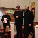 Fr. Mesrop presents performers with congratulatory gifts