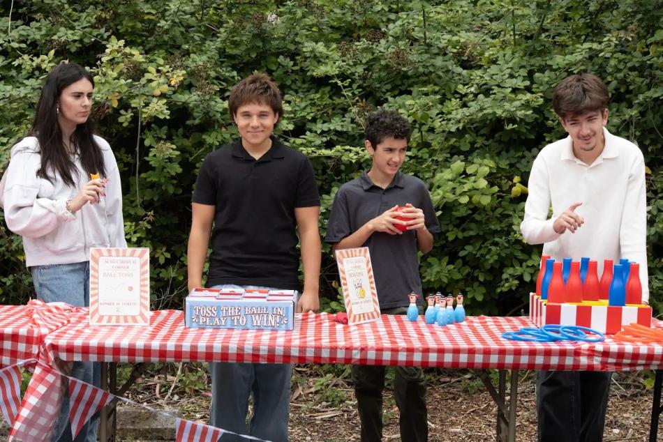 ACYO members operate a fundraiser game booth at the parish picnic