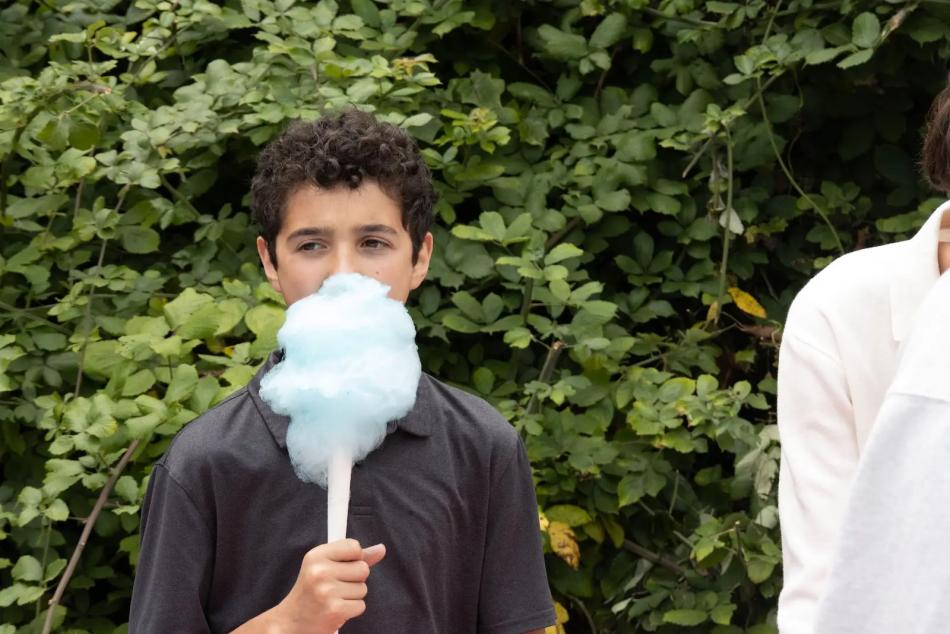 A child enjoys cotton candy at the St. John parish picnic