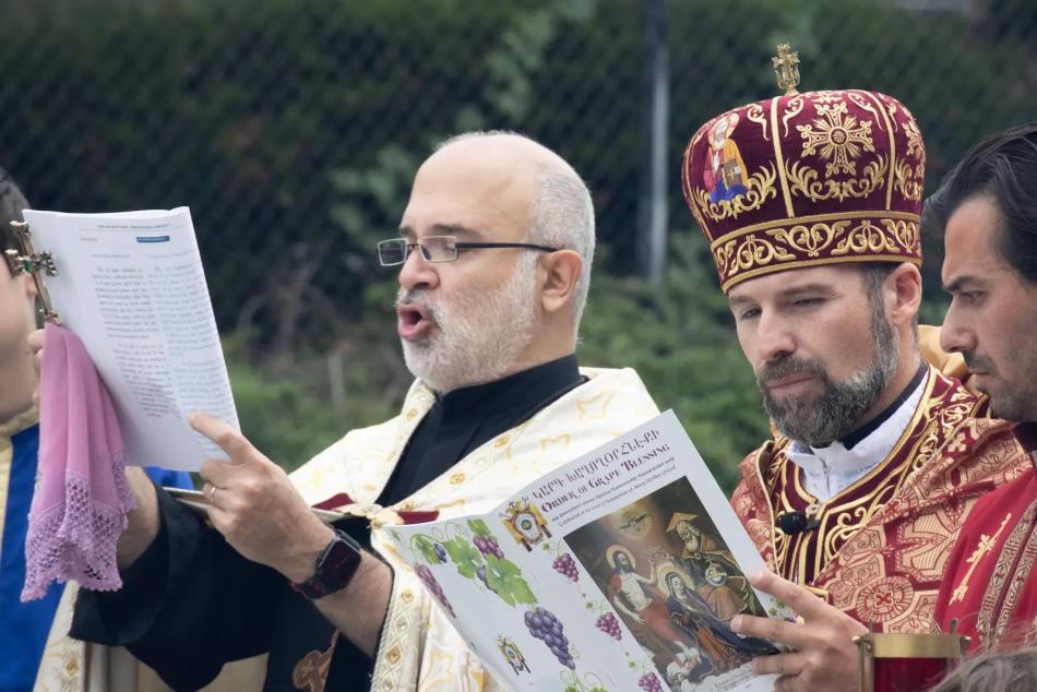 Clergy chant during the Great Blessing of Grapes