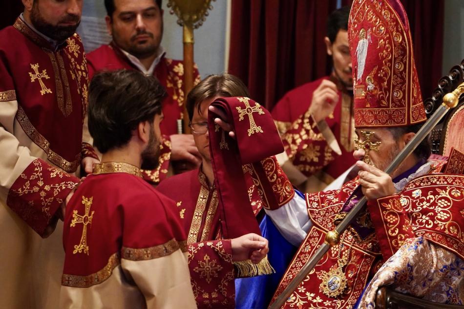 Archbishop Hovnan Derderian blesses Daniel Koloyian during the ordination service Archbishop Hovnan Derderian blesses Daniel Koloyian during the ordination service