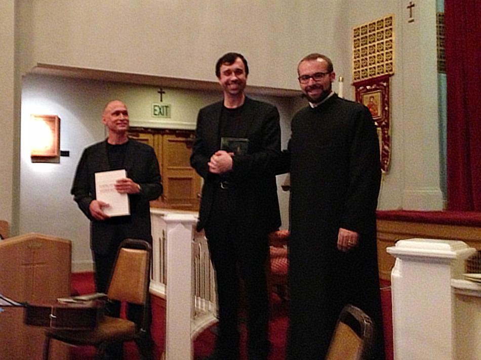 Fr. Mesrop presents performers with congratulatory gifts