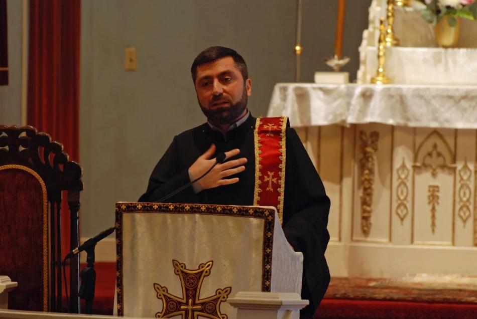 Dn. Mikayel Margaryan delivers the homily during the Feast of the Assumption
