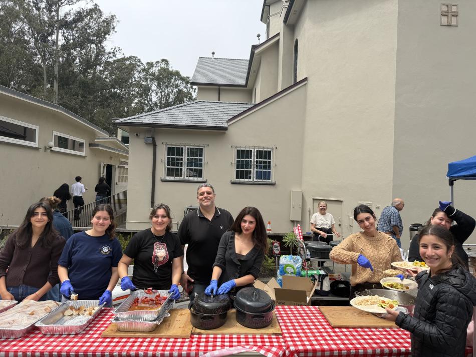 Volunteers serving picnic food